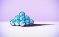 Chrome metal balls in pyramid stack with abstract calm and relaxing background