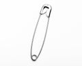 Chrome metal safety pins on white background Essential equipment in any first aid kit Royalty Free Stock Photo