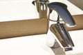 Chrome metallic washbasin sink tap detail. Bathroom decoration Royalty Free Stock Photo