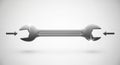 Chrome open-end wrench on a white background, reflecting light on two spots. The Royalty Free Stock Photo