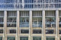 Chrome pillars with reflective windows and bars between in architecture view of Chicago, IL building Royalty Free Stock Photo