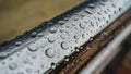 Chrome-plated handrail with water drops Royalty Free Stock Photo