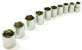 Chrome ratchet sockets in a curve, on white Royalty Free Stock Photo