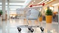 Chrome shopping cart in empty supermarket aisle Royalty Free Stock Photo