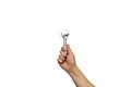 A chrome vanadium spanner on hand isolated over white background. wrench, man`s hand holding spanner, isolated Royalty Free Stock Photo