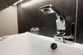 Chrome water tab and seramic sink bowl in bathroom. Royalty Free Stock Photo