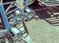 Chromed headlights on the front fork of a trike Royalty Free Stock Photo