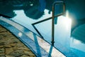 Chromed metal handrail in an outdoor pool