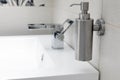 Chromium-plate tap on white sink. Royalty Free Stock Photo