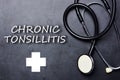 Chronic tonsillitis diagnosis on blackboard with stethoscope, medical concept