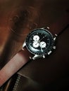 Chronograph wrist watch with metal or leather strap. Swiss made.