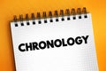 Chronology - science of arranging events in their order of occurrence in time, text concept on notepad