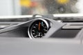 Chronometer with a clock in a luxury sports car. To measure lap times in races. Chronograph in top panel of premium car Royalty Free Stock Photo