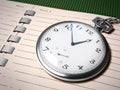 Chronometer over notebook Royalty Free Stock Photo