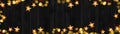 Christmas celebration decoration background banner panorama - Frame made of golden star light chain and bokeh lights on dark black Royalty Free Stock Photo