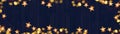 Christmas celebration decoration background banner panorama - Frame made of golden star light chain and bokeh lights on dark blue Royalty Free Stock Photo