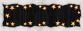 Christmas celebration decoration background banner panorama - Frame made of snow and golden star light chain on dark black wooden