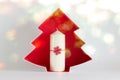 Chrsitmas, New Year composition with candle, red snowflake and red Christmas tree catboard outline on white background