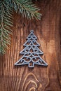 Chrstmas toys fir tree with branches of firtree on old wooden b