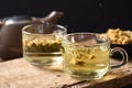 Chrysanthemum flower hot tea in a cup glass and teapot with dry flowers Royalty Free Stock Photo