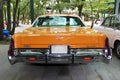 Chrysler New Yorker, 1976 year, USA, dark yellow color, rear view. Royalty Free Stock Photo