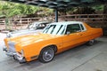 Chrysler New Yorker, 1976 year, USA, dark yellow color. Royalty Free Stock Photo