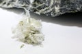 Chrysotile asbestos fibers lie in a heap on a white background Royalty Free Stock Photo