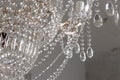 A Chrystal chandelier close-up. Glamour white light background with copy space Royalty Free Stock Photo