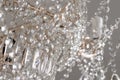 A Chrystal chandelier close-up. Glamour white light background with copy space Royalty Free Stock Photo