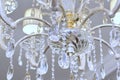 Chrystal chandelier close-up. Glamour white light background with copy space Royalty Free Stock Photo