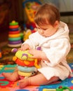 Chubby baby in bathrobe Royalty Free Stock Photo