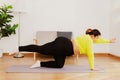 Chubby woman exercises at home for health and fitness Royalty Free Stock Photo