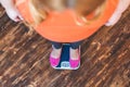 Chubby woman sport at home standing looking at scales top view close-up Royalty Free Stock Photo