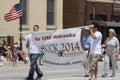 Chuck Hassebrook for Nebraska Governor banner in a parade in small town America