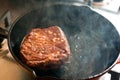 Chuck steak on skillet