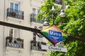 Chueca metro station signboard with summertime background outside in Madrid, Spain. Subway entrance with lgbt symbolic in gay