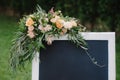 Chulk board, which stands on the grass with wedding inscription Royalty Free Stock Photo