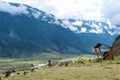 Chulyshman Valley, Altai, Russia - Aug 21, 2017. People enjoy the view of nature in and around a wooden gazebo.