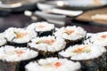 Chumaki Sushi Rolls with Tuna, Salmon, Rice, Cucumber, Avocado And Nori Seaweed on a Plate with Soy Sauce Dipping Dish and Royalty Free Stock Photo