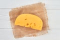 Chunk of cheese on rustic napkin. Royalty Free Stock Photo