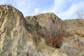 A chunk of mountain, with blue sky, at Knox mountain park in Canada