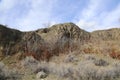 A chunk of mountain, with blue sky, at Knox mountain park in Canada