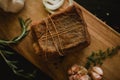 Chunk of salted smoked lard in gauze with a rope.Traditional Russian and Ukrainian meal.Healthy food with spices, herbs