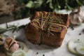 Chunk of salted smoked lard in gauze with a rope.Traditional Russian and Ukrainian meal.Healthy food with spices, herbs