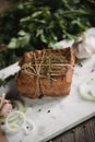 Chunk of salted smoked lard in gauze with a rope.Traditional Russian and Ukrainian meal.Healthy food with spices, herbs