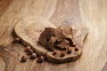 Chunks of gianduja with hazelnuts on wood board Royalty Free Stock Photo