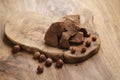 Chunks of gianduja with hazelnuts on wood board Royalty Free Stock Photo