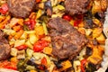 Chunks of pork baked on a baking sheet in the oven with spiced potatoes, bell peppers, zucchini, pumpkin and broccoli. Homemade Royalty Free Stock Photo