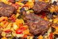 Chunks of pork baked on a baking sheet in the oven with spiced potatoes, bell peppers, zucchini, pumpkin and broccoli. Homemade Royalty Free Stock Photo