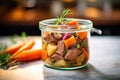 chunky beef stew in a clear glass pot, brightly lit Royalty Free Stock Photo